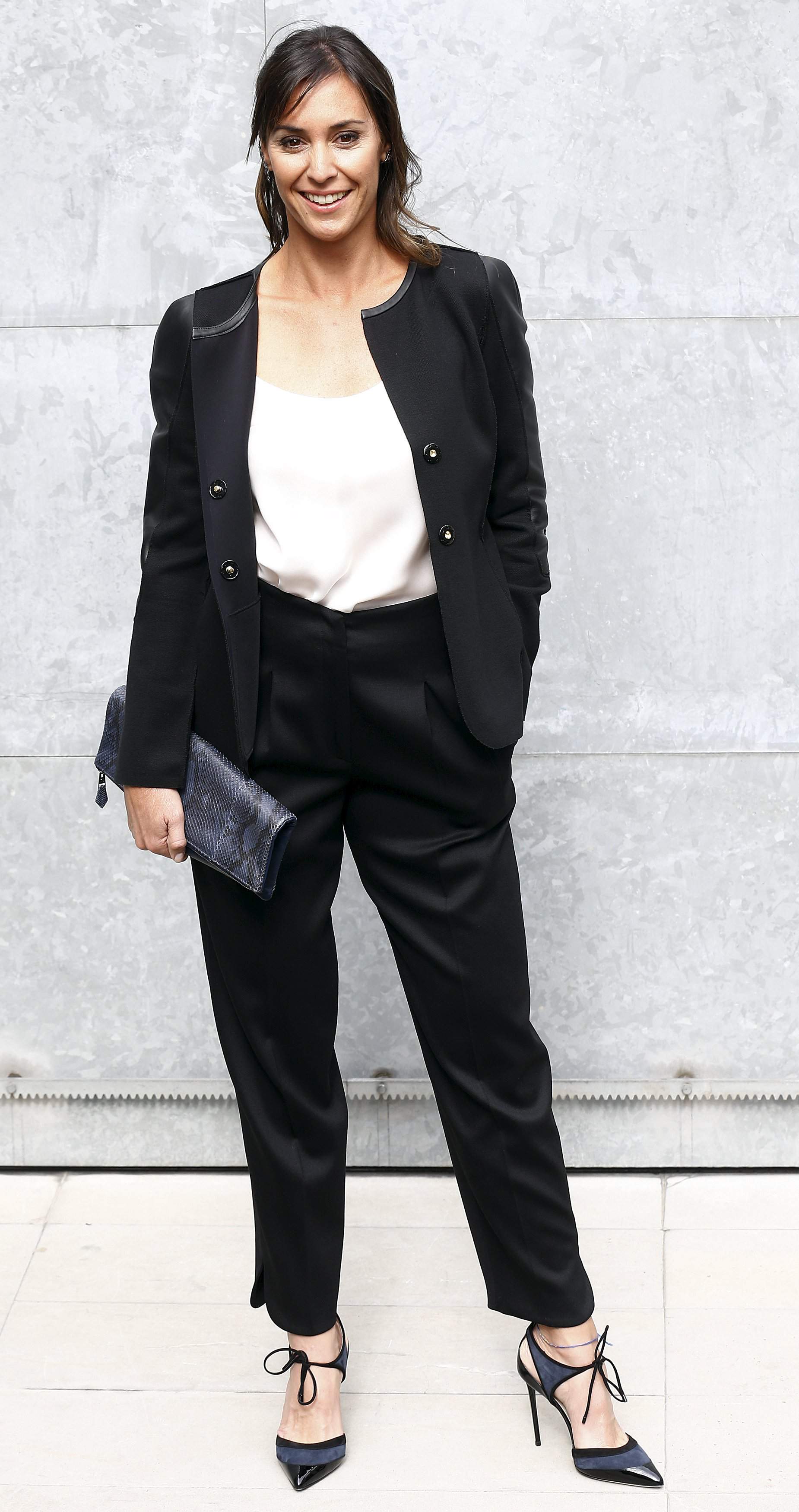 Italian tennis player Flavia Pennetta poses for the photographers before the Giorgio Armani Spring/Summer 2016 collection during Milan Fashion Week in Italy, September 28, 2015.  REUTERS/ Stefano Rellandini