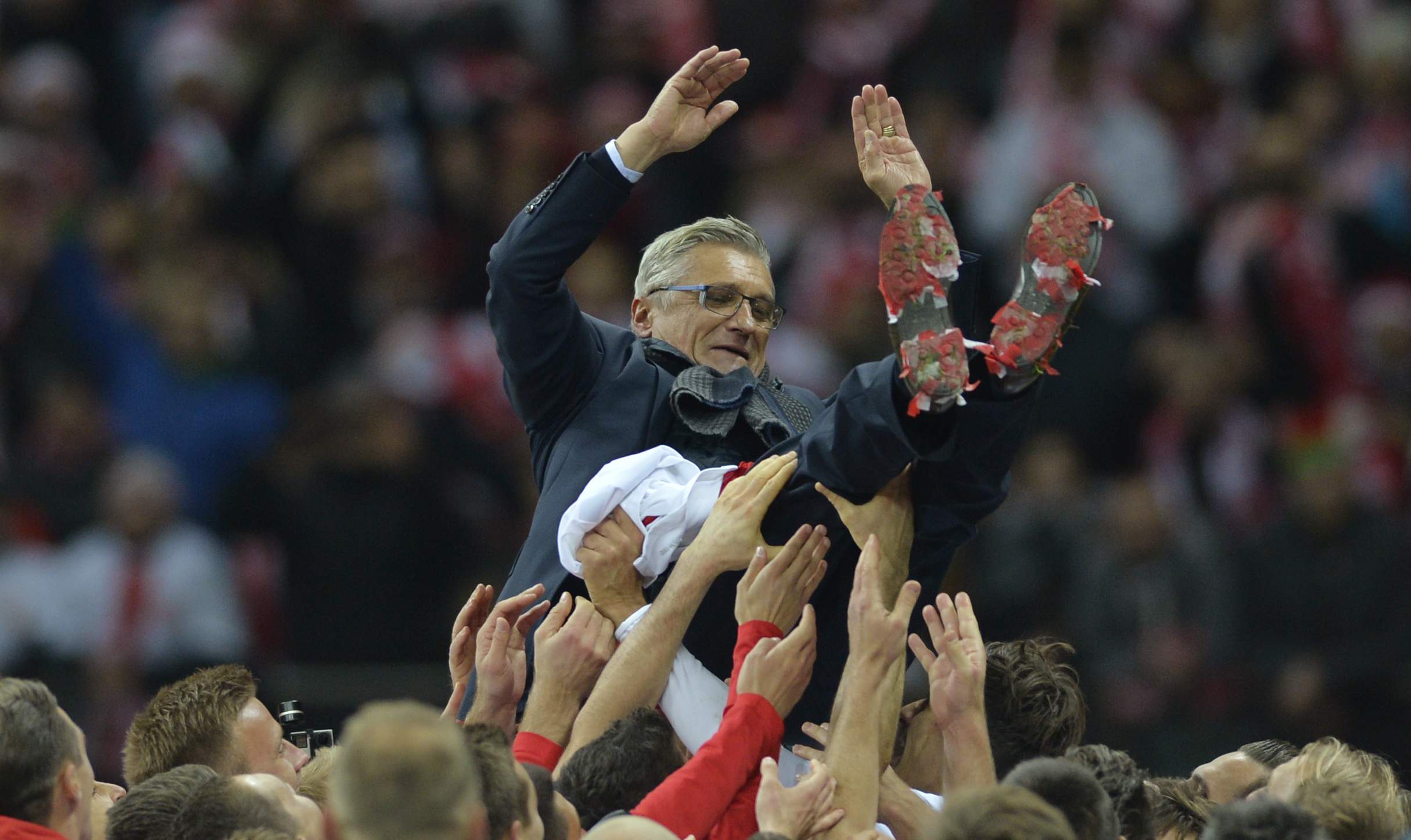 Football - Poland v Republic of Ireland - UEFA Euro 2016 Qualifying Group D - Stadion Narodowy, Warsaw, Poland - 11/10/15 Poland coach Adam Nawalka is thrown in the air by players as they celebrate qualifying for UEFA Euro 2016 after the game  Action Images via Reuters / Adam Holt Livepic EDITORIAL USE ONLY.