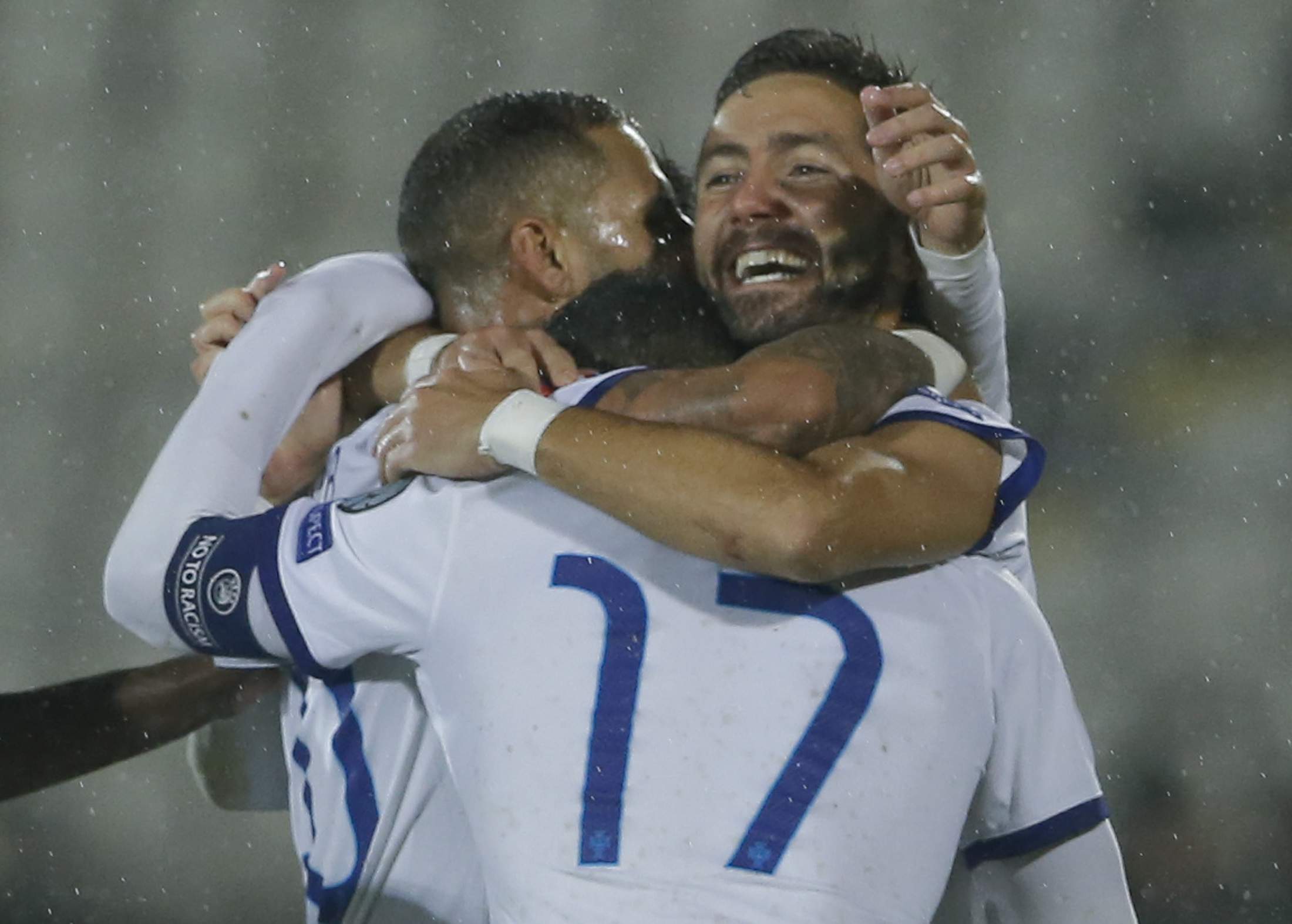 Portugal's Joao Moutinho (R) celebrates his goal against Serbia with fellow team mate Nani (17) and Ricardo Quaresma (L) during their Euro 2016 Group I qualifying soccer match in Belgrade, Serbia October 11, 2015.                    REUTERS/Marko Djurica