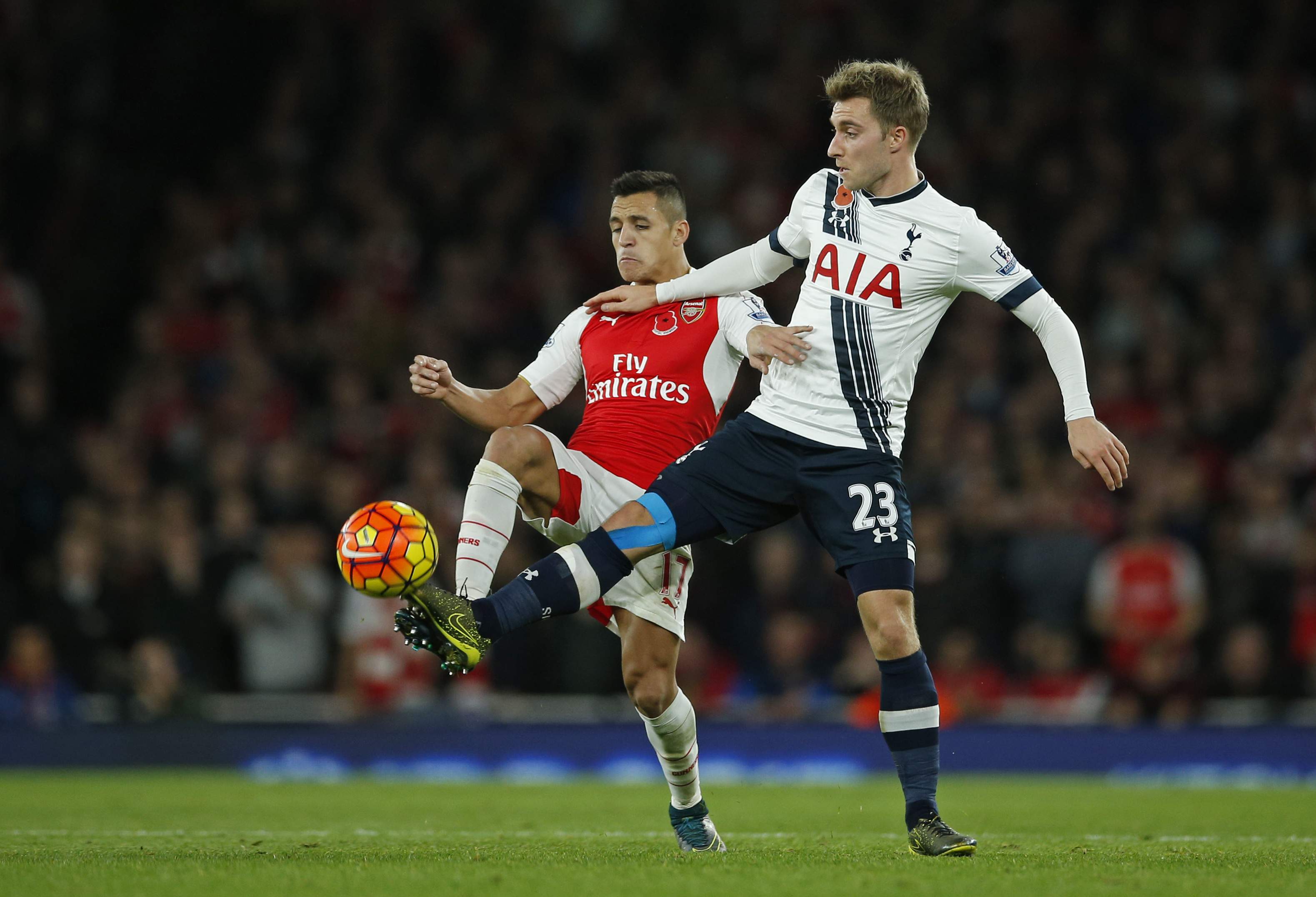 Football - Arsenal v Tottenham Hotspur - Barclays Premier League - Emirates Stadium - 8/11/15 Arsenal's Alexis Sanchez and Tottenham's Christian Eriksen in action Action Images via Reuters / Andrew Couldridge Livepic EDITORIAL USE ONLY. No use with unauthorized audio, video, data, fixture lists, club/league logos or "live" services. Online in-match use limited to 45 images, no video emulation. No use in betting, games or single club/league/player publications.  Please contact your account representative for further details.
